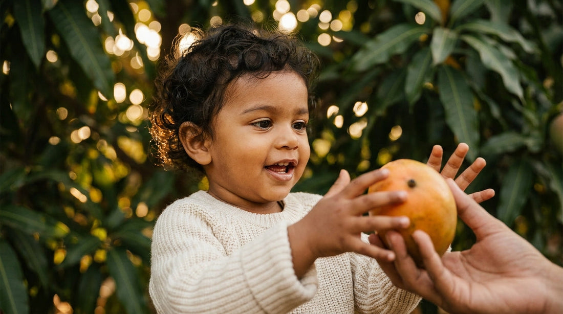 South Asian toddler discovering fruit, representing the wonder of HMOs and early gut health
